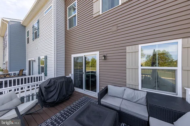 a view of a balcony with lake view and wooden floor