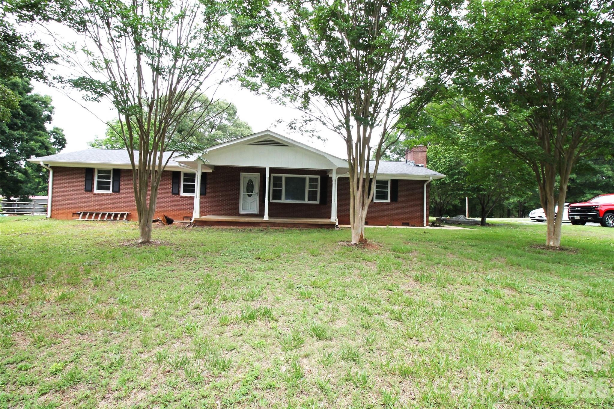203 Ratchford Farm Road Gastonia, NC 28056 - Photo 1 of 38 a front view of a house with a yard