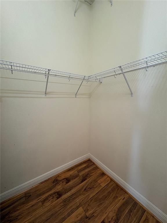 898 San Raphael Street Poinciana, FL 34759 - Photo 19 of 37 a view of a room with racks on the wall