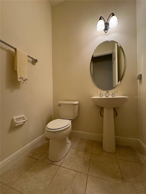 898 San Raphael Street Poinciana, FL 34759 - Photo 24 of 37 a bathroom with a toilet