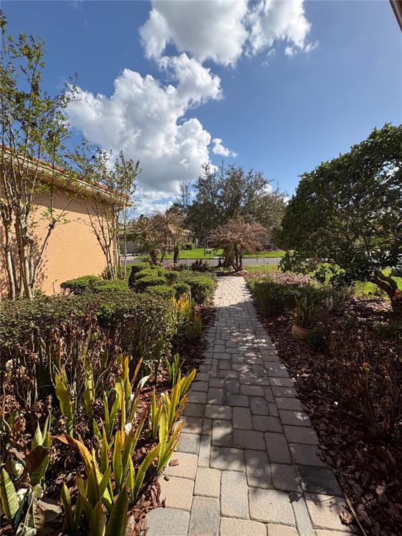 898 San Raphael Street Poinciana, FL 34759 - Photo 28 of 37 a view of a pathway both side of building