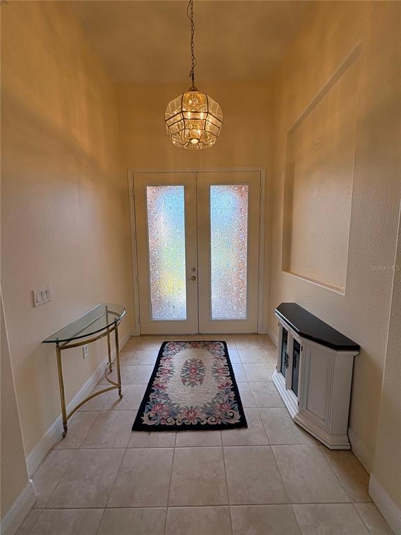 898 San Raphael Street Poinciana, FL 34759 - Photo 3 of 37 a view of a hallway with windows