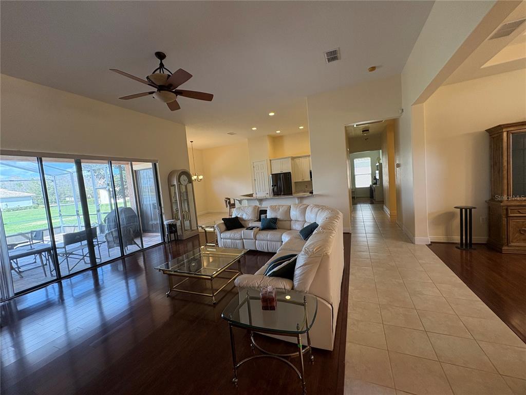 898 San Raphael Street Poinciana, FL 34759 - Photo 6 of 37 a view of a dining room with furniture window and wooden floor