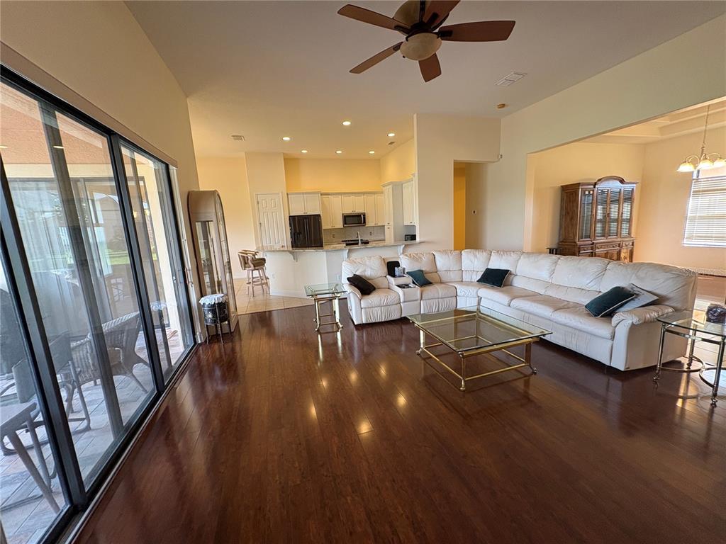 898 San Raphael Street Poinciana, FL 34759 - Photo 7 of 37 a living room with furniture and a large window