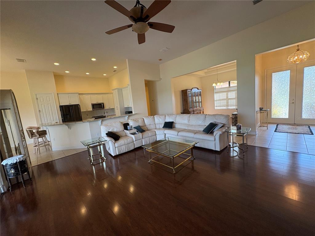 898 San Raphael Street Poinciana, FL 34759 - Photo 8 of 37 a living room with furniture and a large window