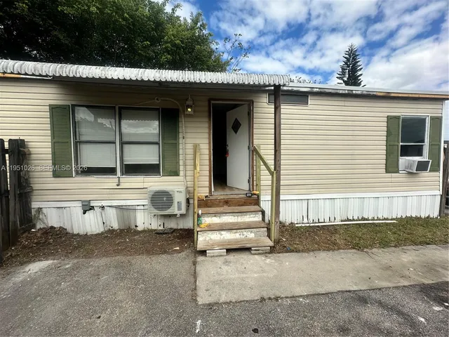 a front view of a house with a garage