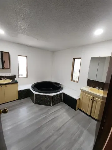 a kitchen with a sink and a stove top oven