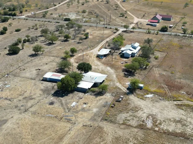 a view of a backyard of the house