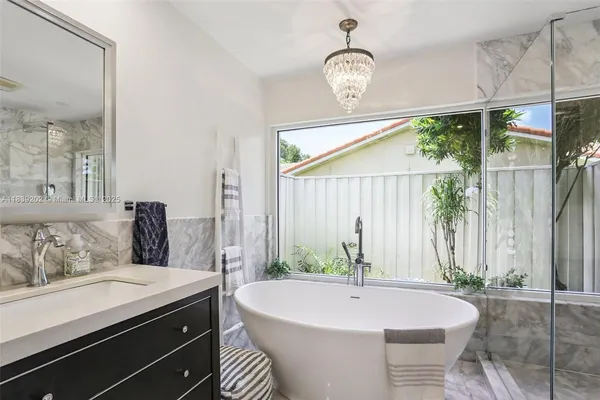 a bathroom with a bathtub and a sink