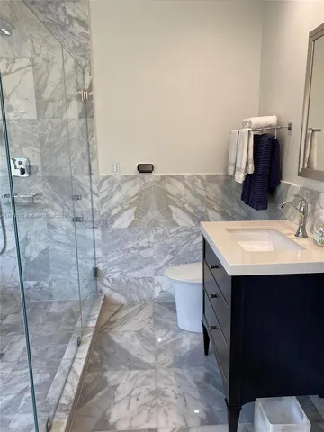 a bathroom with a sink and mirror