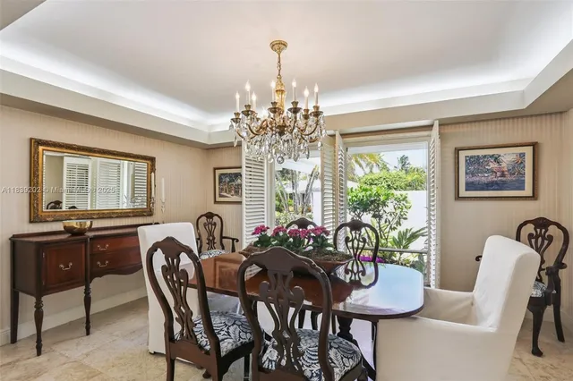 a kitchen with a sink dishwasher a refrigerator and white cabinets with wooden floor