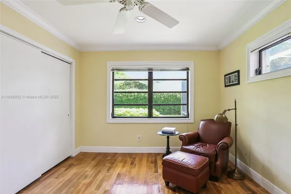 a view of a wooden door and a bench in a yard