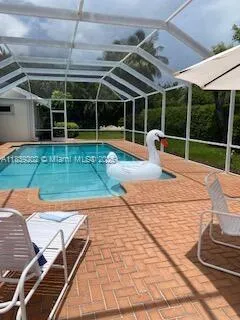 a view of a backyard with sitting area