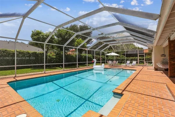a view of a swimming pool with a porch