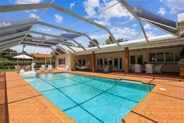 a view of a patio with table and chairs with an outdoor space