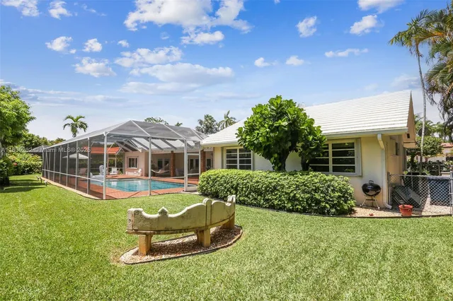 a front view of house with yard and outdoor seating