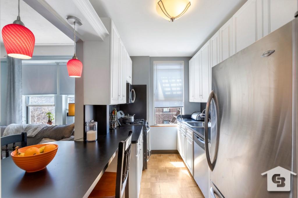7201 4th Avenue, Unit D2 Brooklyn, NY 11209 - Photo 1 of 6 a kitchen with stainless steel appliances granite countertop a refrigerator and a stove