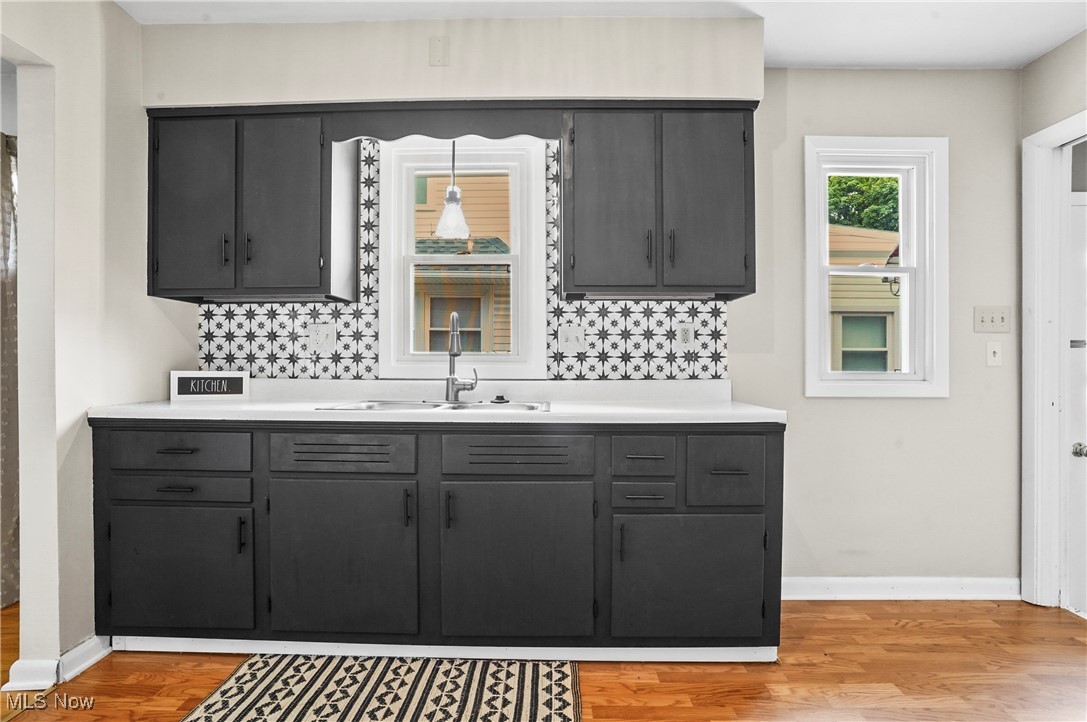 1071 Chalker Street Akron, OH 44310 - Photo 5 of 23 Kitche, flooring, backsplash, and sink