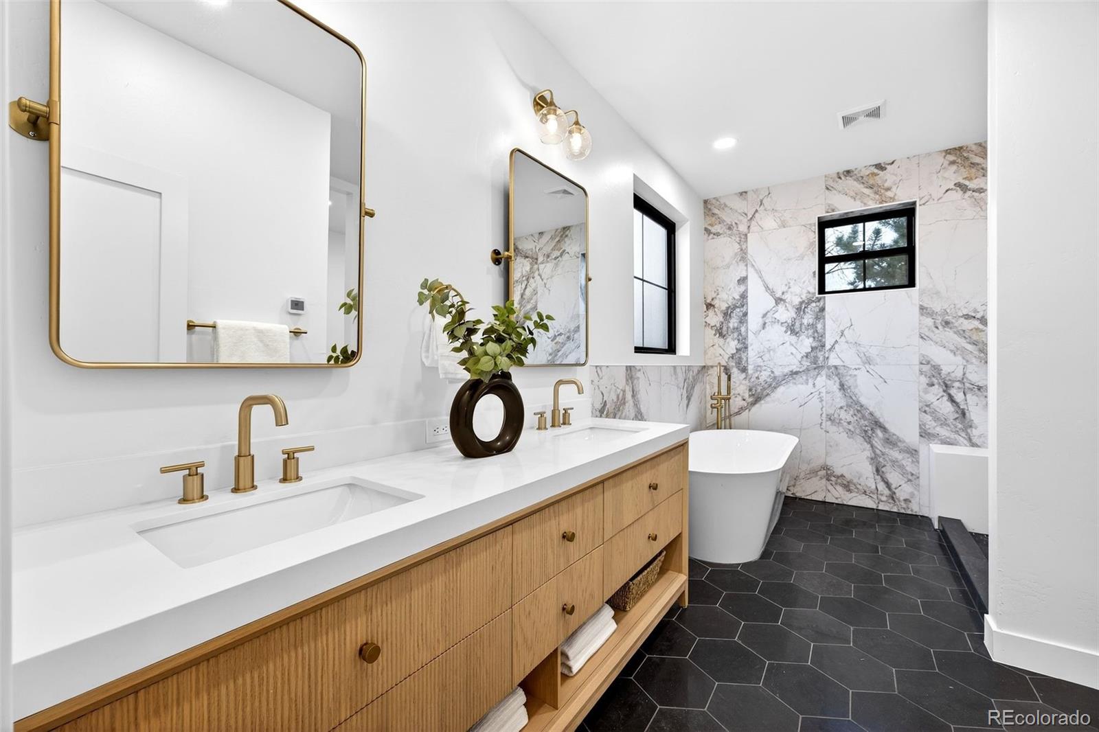 5175 Raleigh Street Denver, CO 80212 - Photo 9 of 49 a bathroom with a double vanity sink mirror and toilet