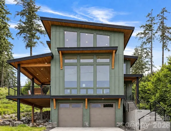 a front view of a house with garage