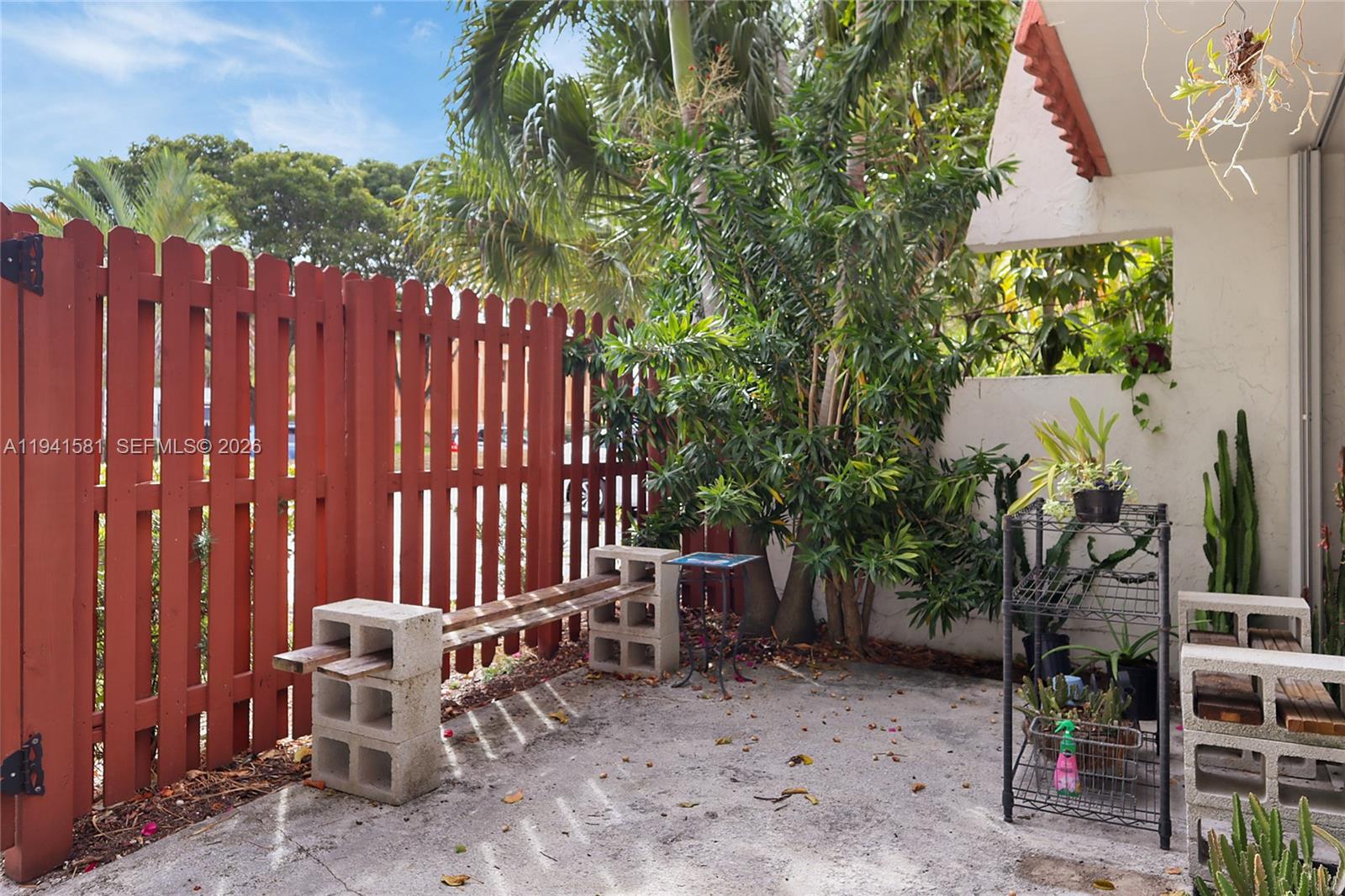 14009 Southwest 84th Street Miami, FL 33183 - Photo 15 of 15 a view of a chair and table in the backyard