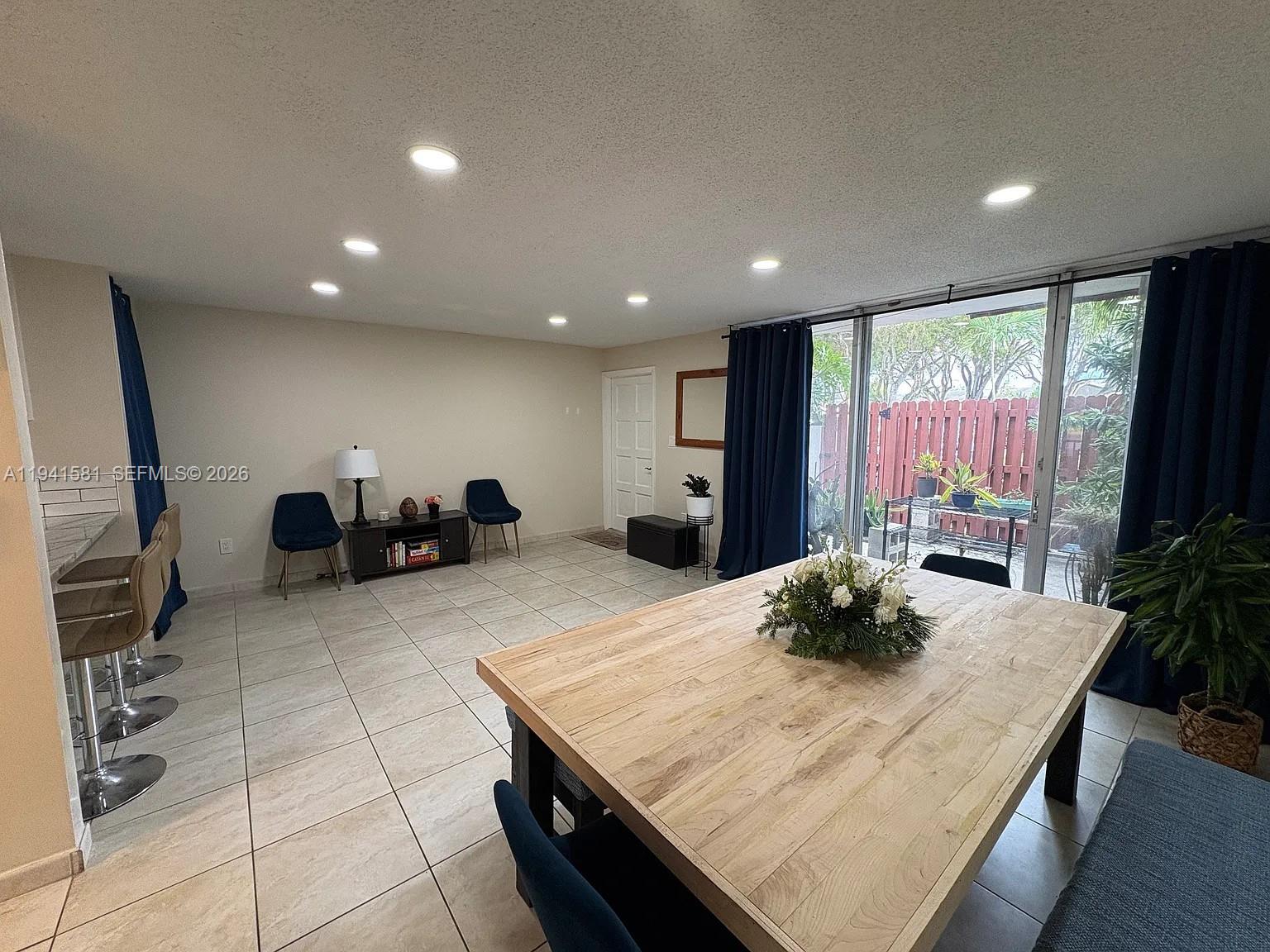 14009 Southwest 84th Street Miami, FL 33183 - Photo 4 of 15 a living room with furniture and a large window