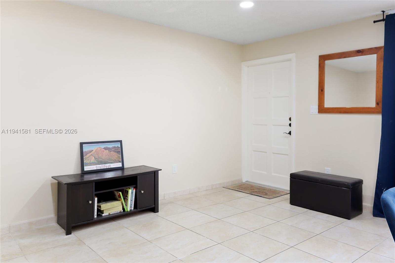 14009 Southwest 84th Street Miami, FL 33183 - Photo 5 of 15 a living room with a couch