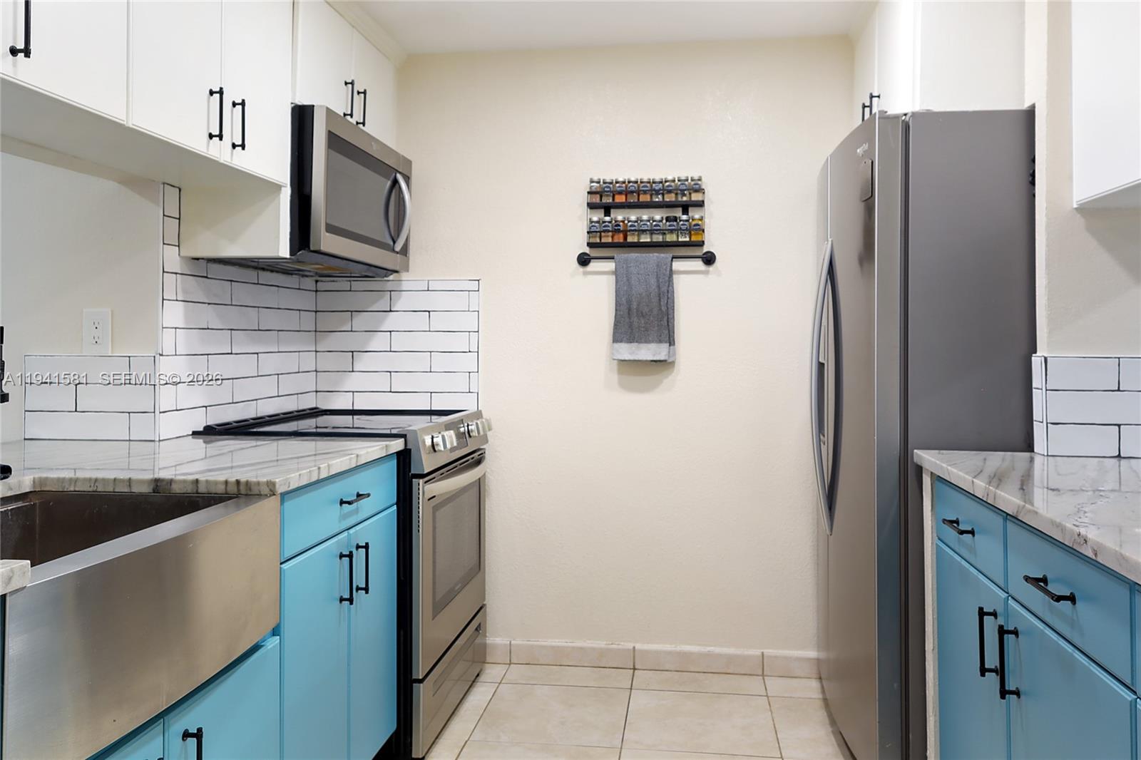 14009 Southwest 84th Street Miami, FL 33183 - Photo 6 of 15 a kitchen with stainless steel appliances granite countertop a refrigerator and a stove