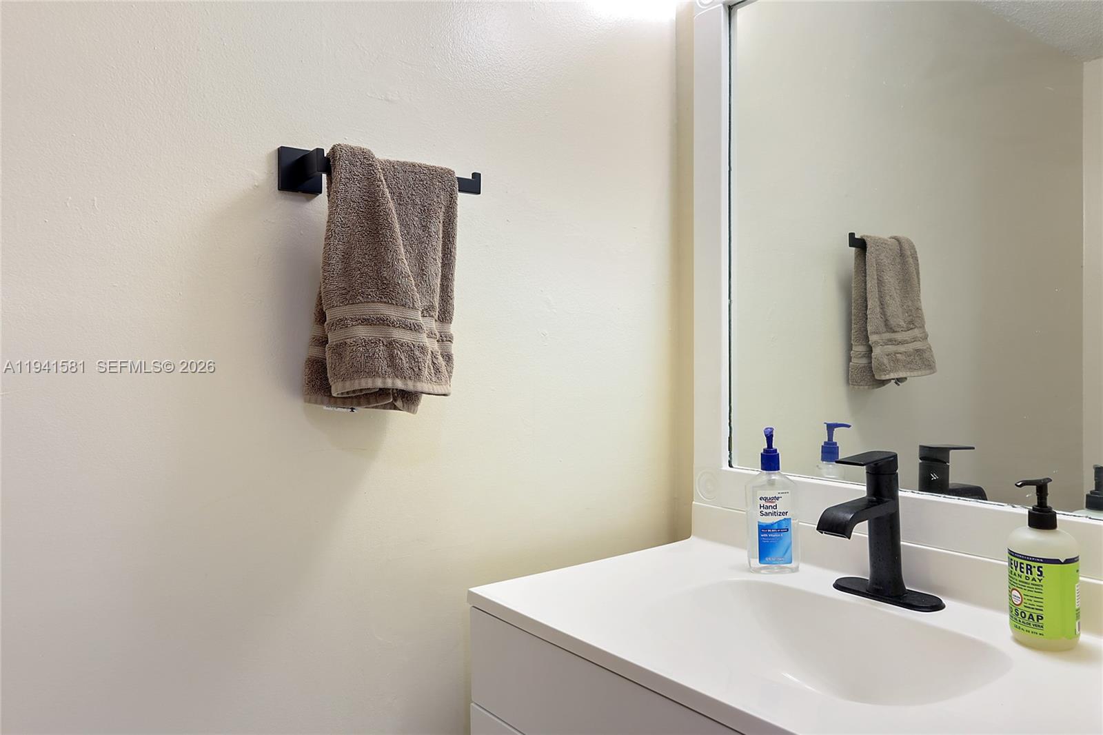 14009 Southwest 84th Street Miami, FL 33183 - Photo 7 of 15 a bathroom with a sink and a mirror