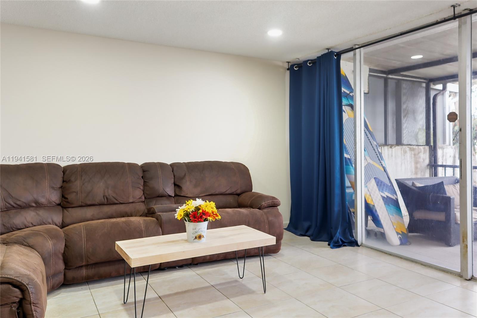 14009 Southwest 84th Street Miami, FL 33183 - Photo 9 of 15 a living room with furniture and a wooden floor