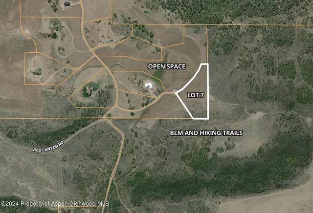 a blue sign that is on the side of a building