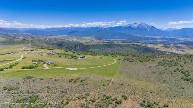 a view of a lake with mountains in the background