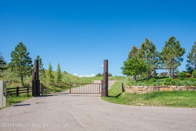 a view of a street with a park