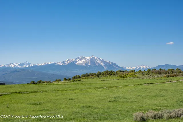 a view of a mountain with a outdoor space