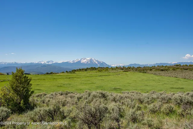 a view of an ocean and a mountain