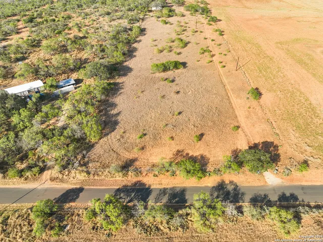 a view of mountains with green space