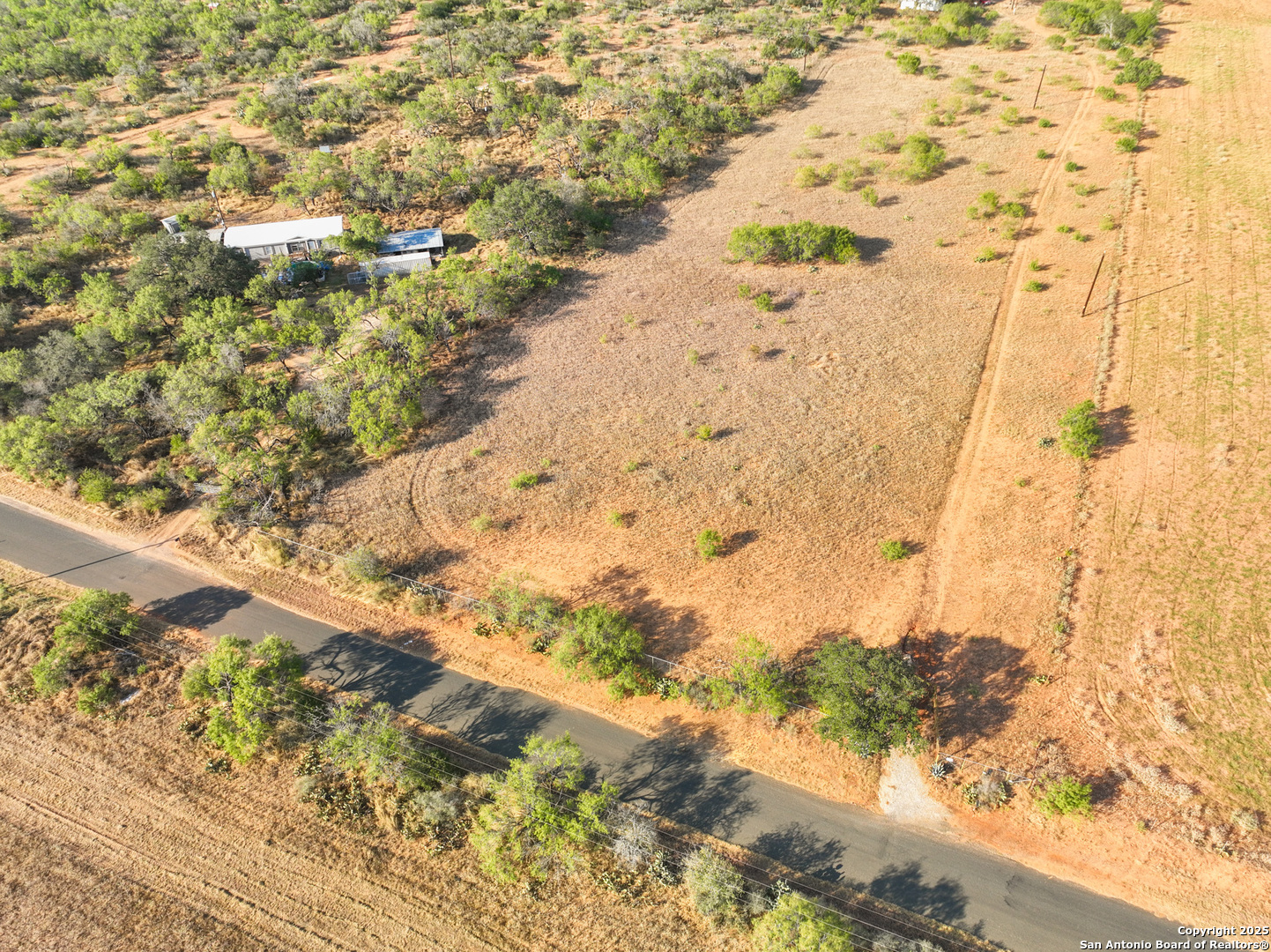 1750 Sandbranch Road Poteet, TX 78065 - Photo 4 of 17 a view of beach with wooden floor