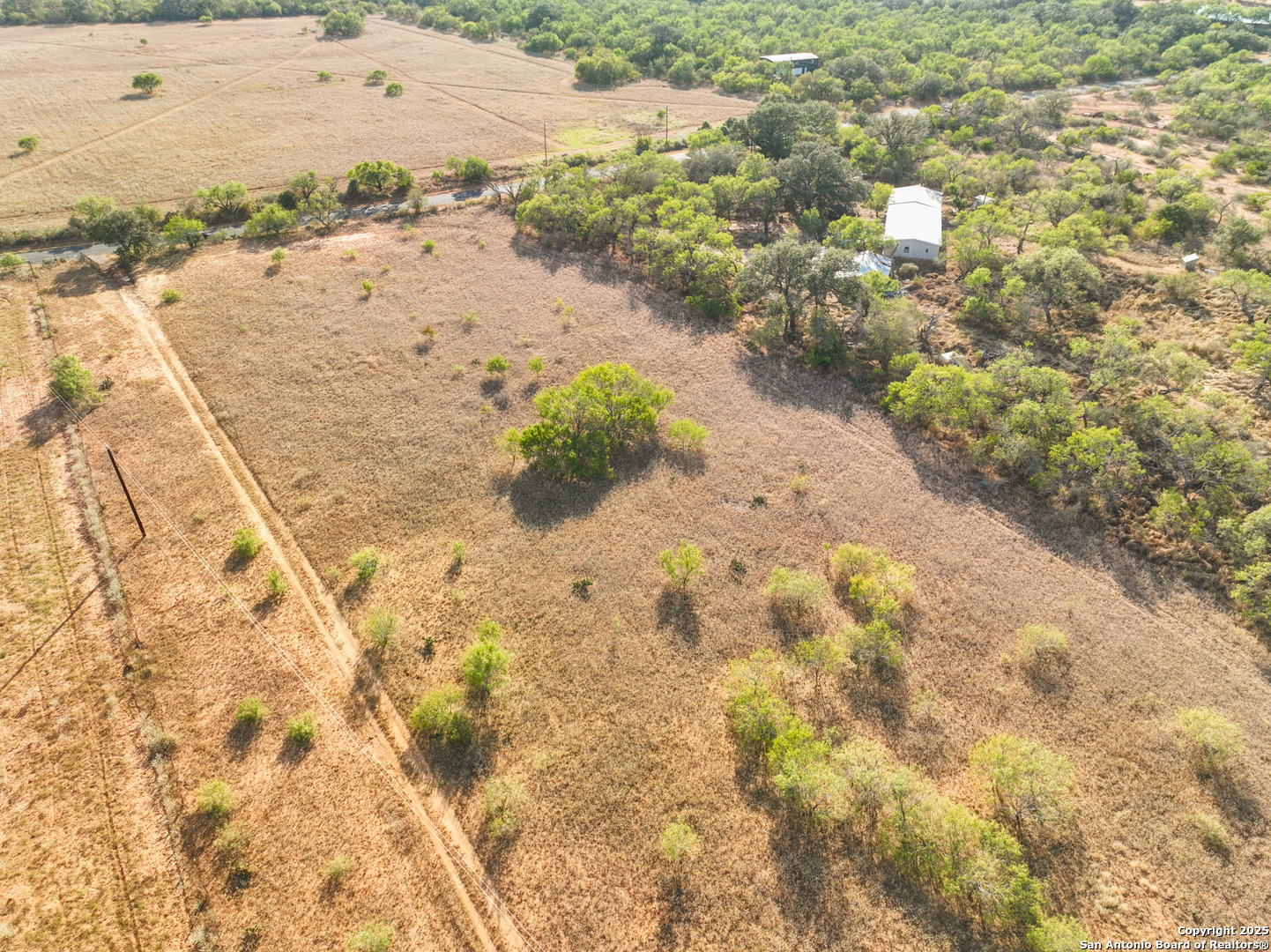 1750 Sandbranch Road Poteet, TX 78065 - Photo 5 of 17 a view of a beach with a yard