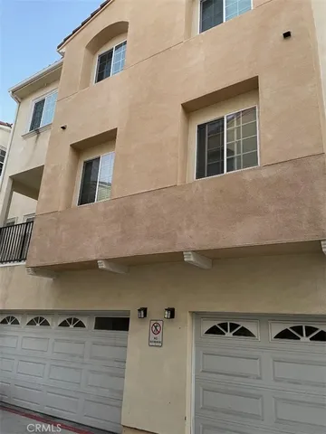 a front view of a house with many windows