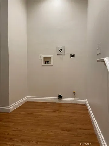 a bathroom with a granite countertop toilet sink and mirror