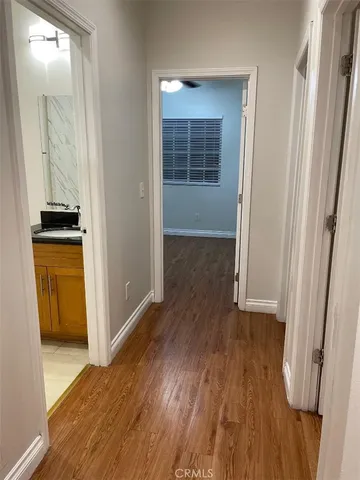 a bathroom with a white bath tub and a sink