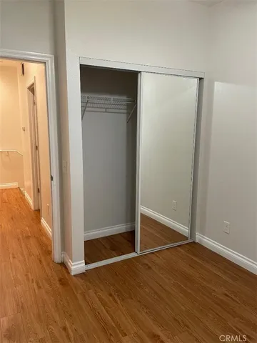 a view of room with wooden floor