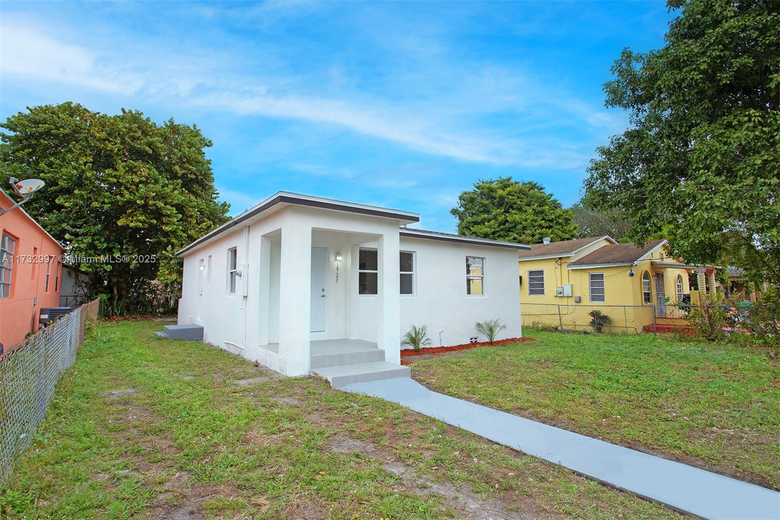 1923 Northwest 66th Street Miami, FL 33147 - Photo 1 of 29 a view of a house with a yard