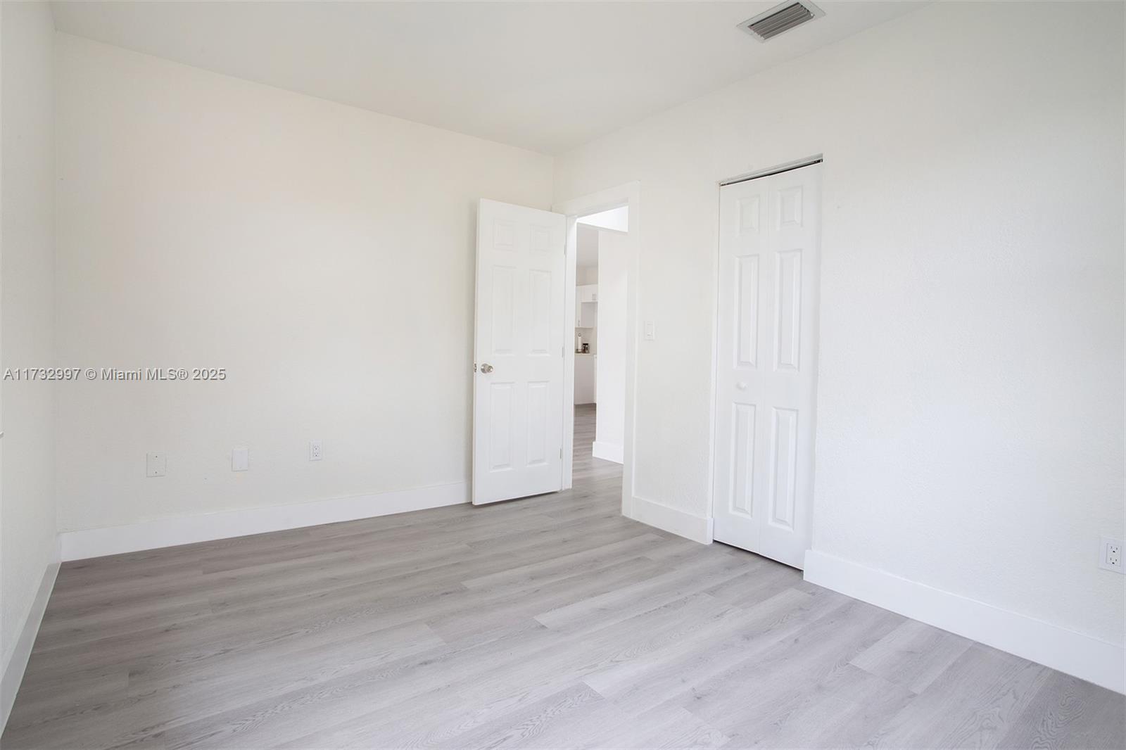 1923 Northwest 66th Street Miami, FL 33147 - Photo 19 of 29 a view of an empty room