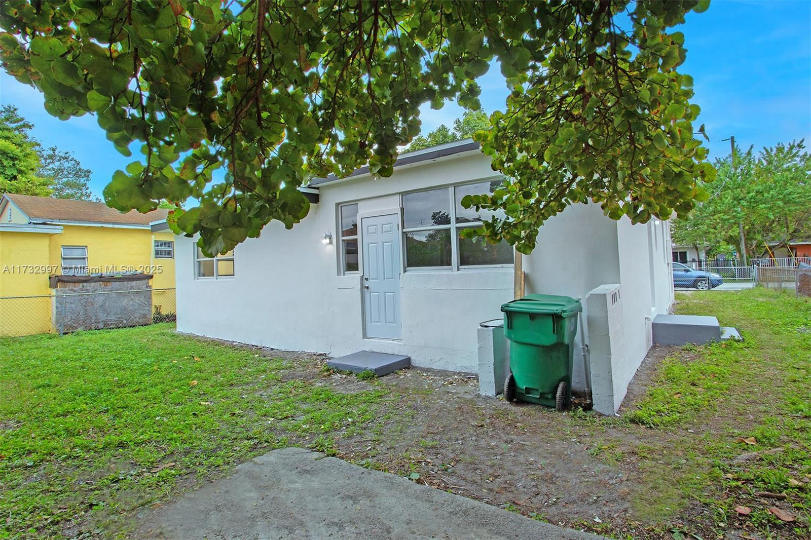 1923 Northwest 66th Street Miami, FL 33147 - Photo 26 of 29 a front view of a house with garden