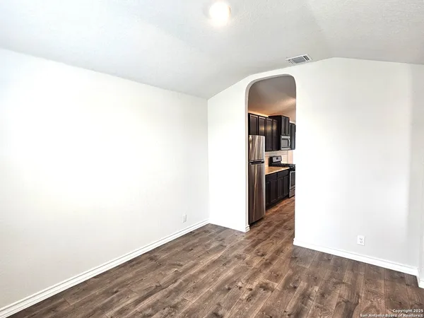 a view of a room with a hallway