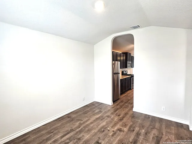 a view of a room with a hallway