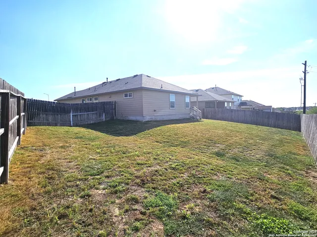 a house view with swimming pool and sitting space