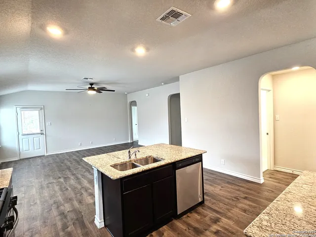 a bathroom with a sink vanity and mirror