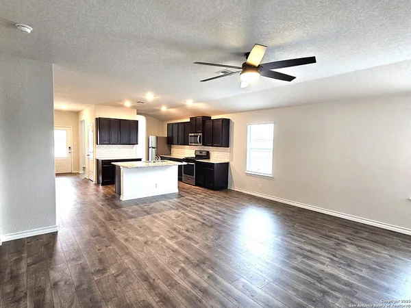 a view of living room with furniture and a flat screen tv